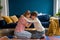 Affectionate empathic caring mom and teen son hug together sit on floor in living room at home.