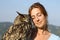 Affectionate falconer with an eagle owl outdoors