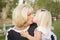 Affectionate Grandmother and Granddaughter At The Park