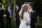 Affectionate groom kissing bride on forehead