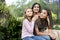 Affectionate mother and two daughters sitting