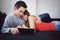 Affectionate teenage couple using tablet PC