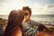 Affectionate young couple kissing at the beach