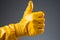 Affirming excellence, Workers gloved hand gives thumbs up, embodying quality service concept