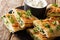 Afghan fried flat breads with potatoes, green onions and cilantro closeup. horizontal