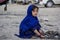 An afghan girl who collects all the rubber from workshops