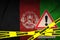 Afghanistan flag and Covid-19 quarantine yellow tape. Coronavirus or 2019-nCov virus