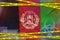 Afghanistan flag and Covid-19 quarantine yellow tape. Coronavirus or 2019-nCov virus concept