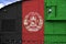 Afghanistan flag depicted on side part of military armored tank closeup. Army forces conceptual background