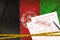 Afghanistan flag and Health insurance claim form with covid-19 stamp. Coronavirus or 2019-nCov virus concept