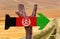 Afghanistan Flag wooden sign with desert background