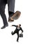 Afraid businessman running away from a big foot