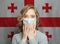 Afraid woman in medical mask on Georgian flag background. Flu epidemic and domestic violence in Georgia concept