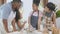 African America family wearing apron for cooking and playing flour together in the kitchen at home.