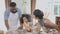 African America family wearing apron thresh flour for cooking and dancing and song together in the kitchen.