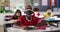 African american boy wearing face mask while sitting on his desk in the class at school