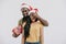 african american boyfriend closing girlfriend eyes and holding new year present