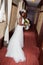 African american bride smiling at the camera holding bouquet