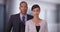 African American business professionals pose for a portrait in their office building