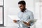 African american businessman with folder at office