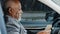 African american businessman sitting in car with bunch dollars counting paper banknotes counts money cash salary