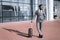 African American Businessman Traveler Standing With Suitcase Near Airport Outdoors