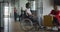 African American businessman in a wheelchair engages in a professional discussion with his colleague, addressing various