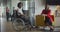African American businessman in a wheelchair engages in a professional discussion with his colleague, addressing various