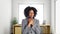 African American Businesswoman In an Office With Sore Throat