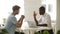 African american and caucasian businessmen negotiating handshaking over office desk