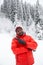 African American Cheerful black man in ski suit in snowy winter outdoors