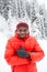 African American Cheerful black man in ski suit in snowy winter outdoors, Almaty, Kazakhstan