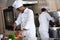 african american chef cutting bell pepper