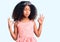 African american child with curly hair wearing princess crown relax and smiling with eyes closed doing meditation gesture with