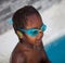 African American child with goggles in the pool