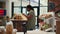 African american client pouring various bulk products from jars