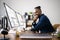 African American Coder Using Computer At Desk