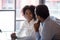 African american colleagues businessman and businesswoman talking in office