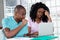 African american couple looking online for jobs