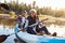 African American Couple Rowing Kayak On Lake