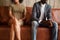 African-american couple sitting on couch after quarrel, bad rela