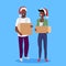 African american couple woman man santa red hat holding paper parcel box delivery concept happy postman male female