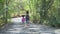 African american cute little sisters hiking in a forest . Two black girl on field trip in nature . Group of school children with