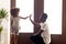 African American dad give high five to small daughter