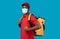 African american delivery man in medical mask wearing thermo bag