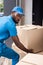 african american delivery man putting boxes