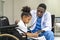 African american doctor is diagnosis the disability kid on wheelchair by using stethoscope for lung checkup and side effect on