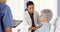 African American doctor listening to elderly patient\'s heart with stethoscope