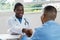 African american doctor welcoming patient