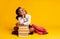 African American Elementary Student Girl Dreaming Sitting At Book Stack